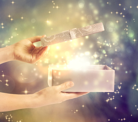 A magical glowing present box being opened の写真素材