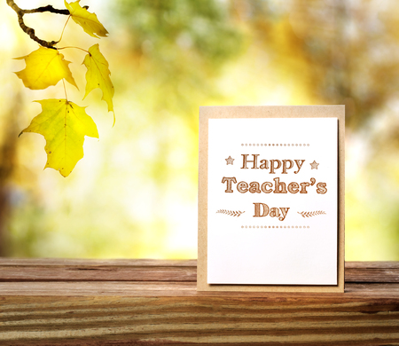 Happy Teachers Day greeting card on shinning fall backgroundの写真素材