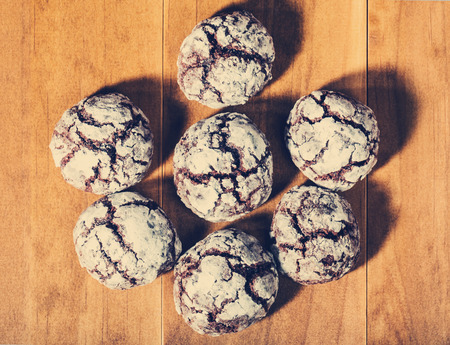 Homemade baked chocolate snacks on wooden table background
