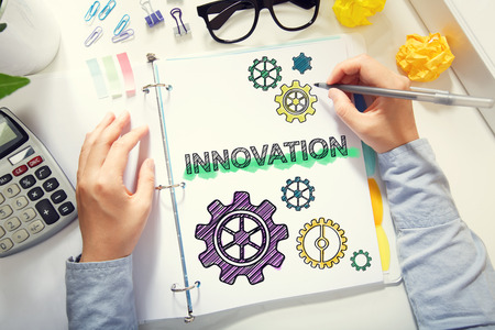 Person drawing Innovation concept on white paper in the officeの写真素材