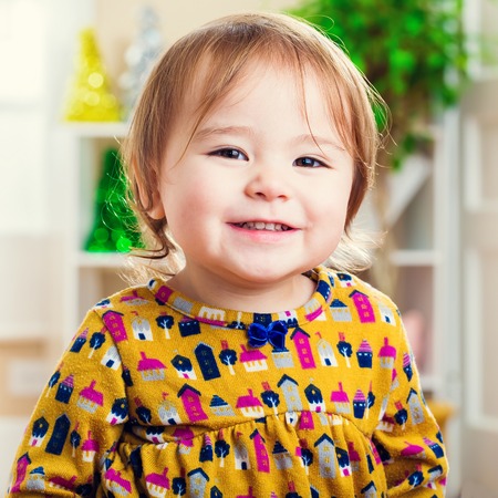 Happy little toddler girl with a nice smileの写真素材