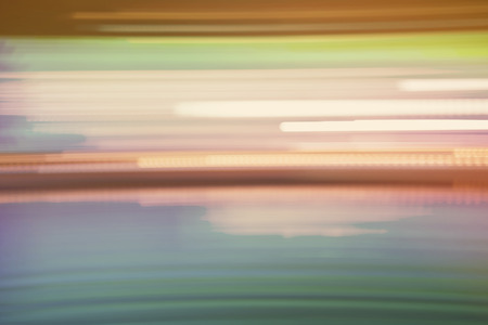 Abstract colorful horizontal streaked city lights background