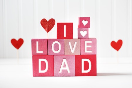 I Love Dad texts on red and pink wooden blocksの写真素材