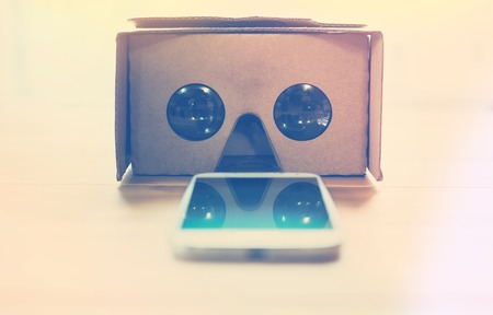 Virtual reality cardboard headset on a table in natural light