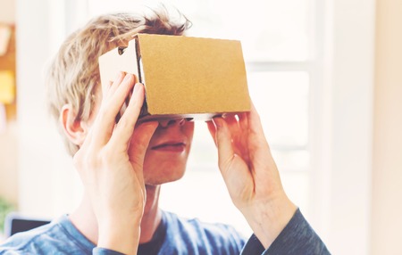 Man using a new virtual reality headsetの写真素材