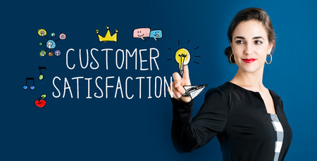 Customer Satisfaction concept with business woman on a dark blue backgroundの写真素材
