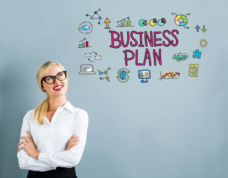Business Plan text with business woman on a gray backgroundの写真素材