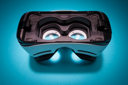 Virtual reality headset device on a blue background