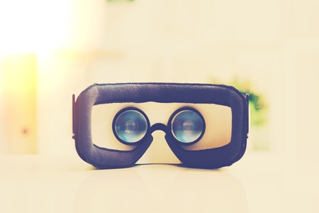 Virtual reality headset device on desk in a bright interior office