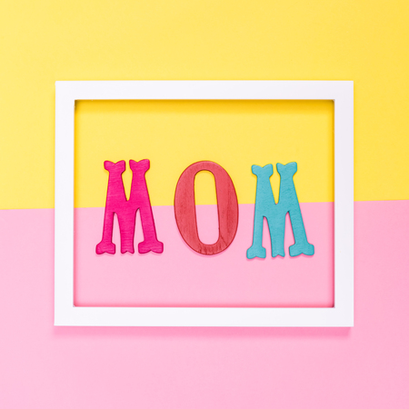 Mother's Day theme on a pastel yellow and pink backgroundの写真素材