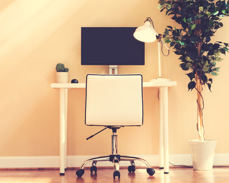 Workstation desk in a large interior roomの写真素材