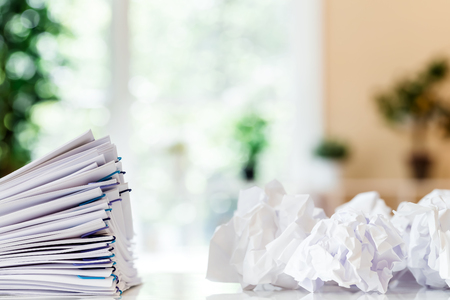 Stack of documents organized with paper clips in an office