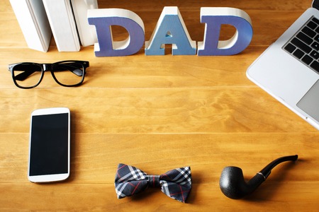Father's Day desktop workspace with gadgets and accessoriesの写真素材