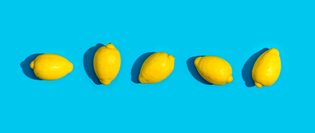 Series of lemons on a blue backgroundの写真素材