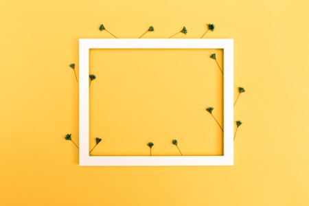 Picture frame with little flowers on a yellow background
