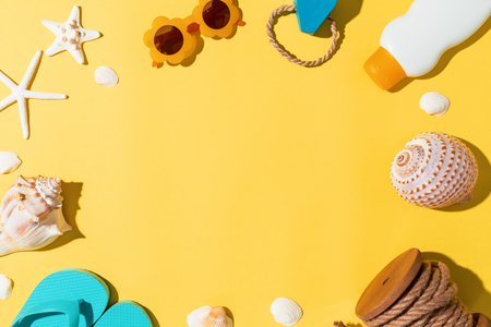Summer lifestyle objects theme on a yellow backgroundの写真素材