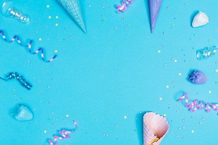 Party theme in blue and purple with streamers and ice cream conesの写真素材
