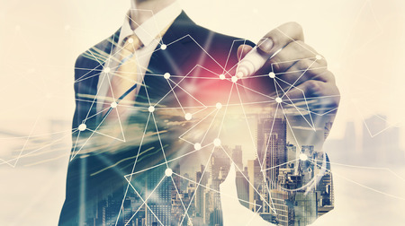 Links with double exposure of businessman and big cityの写真素材