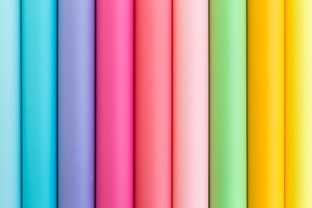 Colorful bright rolls of a paper arranged in a row