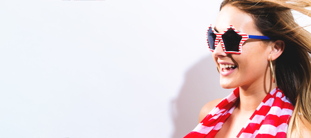 Happy young woman red striped scarf - USA Holiday