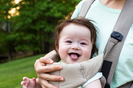 Happy baby boy outside with his familyの写真素材