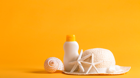 Summer and beach objects theme on a bright yellow backgroundの写真素材