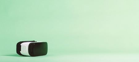 Virtual reality headset device on a green backgroundの写真素材