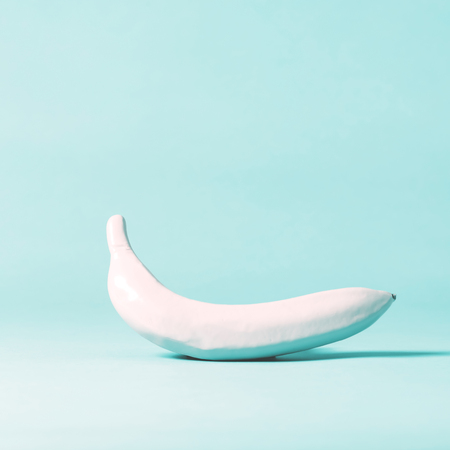 Painted funky banana on a bright backgroundの写真素材