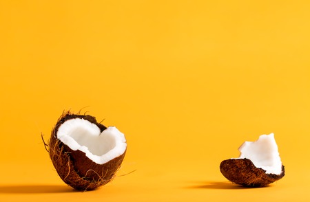 Fresh coconut on a bright yellow backgroundの写真素材
