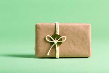 Handmade present box on a bright green backgroundの写真素材