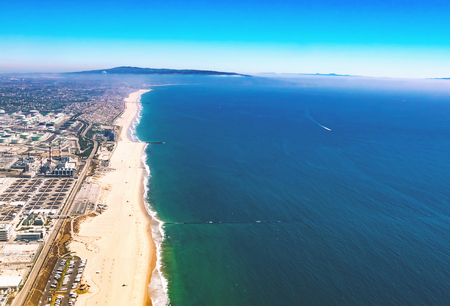 Aerial view of an oil refinery on the beach of El Segundo, Los Angeles, CAの写真素材