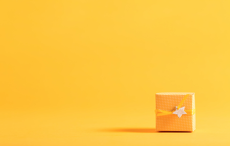 Little handmade present box on a bright backgroundの写真素材