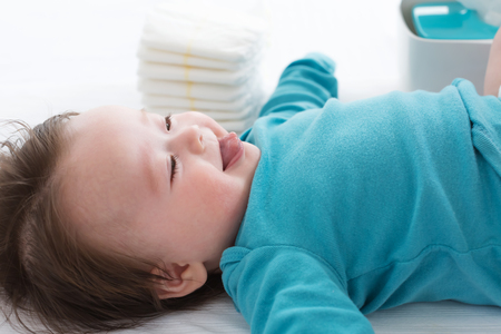 Little baby boy preparing for a diaper changeの写真素材