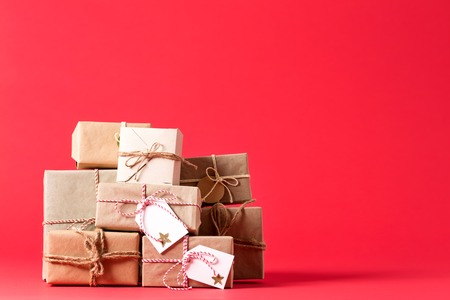 Collection of Christmas present boxes on a red background