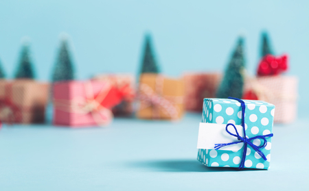 Christmas present box on a light blue backgroundの写真素材