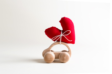 Valentines day theme with heart shaped cushions on toy carの写真素材