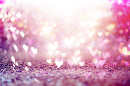 Beautiful shiny hearts and abstract lights backgroundの写真素材