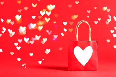 Gift bag with heart with shiny heart lightsの写真素材