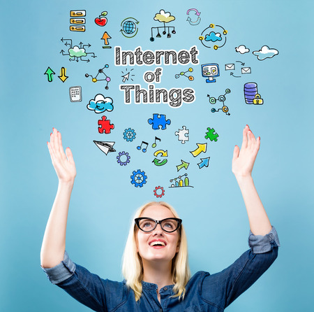 Internet of Things with young woman reaching and looking upwardsの写真素材