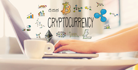 Cryptocurrency with woman using a laptop in brightly lit roomの写真素材