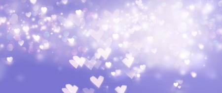 Beautiful shiny hearts and abstract lights backgroundの写真素材