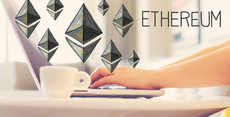 Ethereum with woman using a laptop in brightly lit room