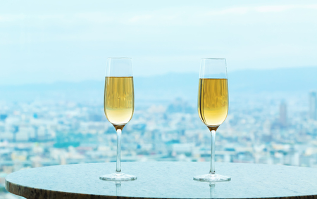 White wine on a table high above the cityの写真素材