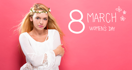Womens Day message with beautiful young woman with a garlandの写真素材