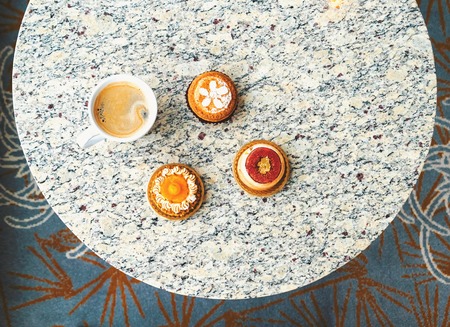 Handcrafted gourmet fruit tarts and pastries with coffeeの写真素材