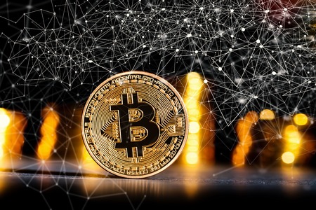 Bitcoin cryptocurrency coin on a dark background
