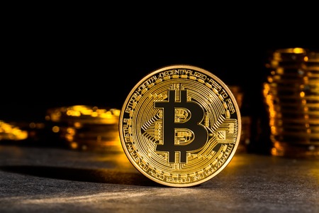 Bitcoin cryptocurrency coin on a dark backgroundの写真素材