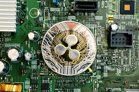 Ripple cryptocurrency coin on a computer chipの写真素材