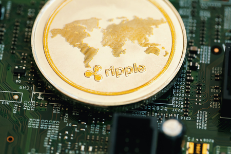 Ripple cryptocurrency coin on a computer chipの写真素材