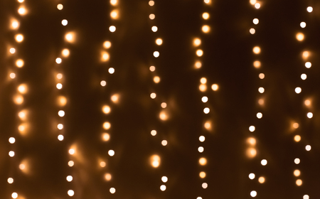 Bokeh abstract blurred lights vertical strings backgroundの写真素材